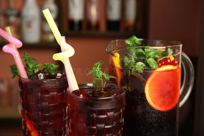Glasses and Jug with Delicious Refreshing Cocktail, Closeup Stock Photo