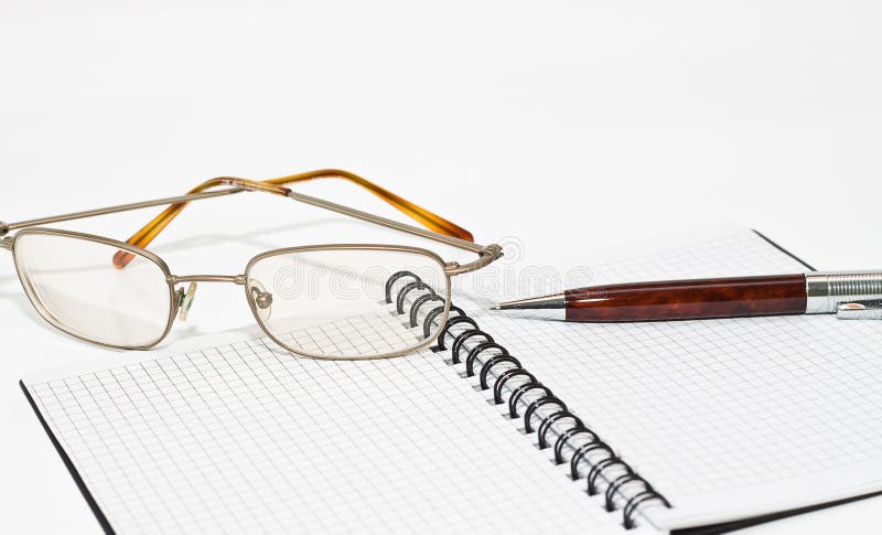 Glasses, notebook and the pen