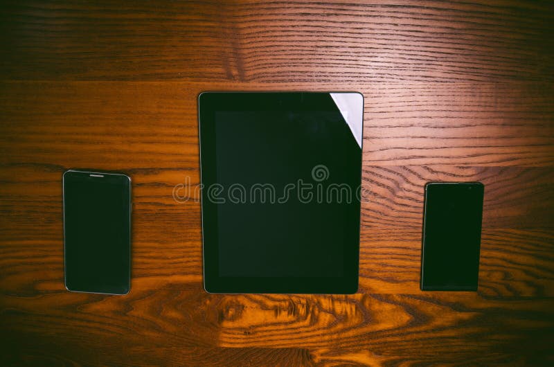 Glasses with pen and tablet on a wooden natural table. Home office. Concept of work in a office and accessories royalty free stock photos Glasses with pen and tablet on a wooden natural table. Home office. Concept of work in a office and accessories royalty free stock photos