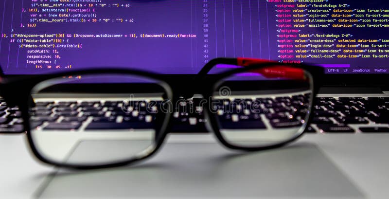 Glasses placed on the laptop At the back is the screen of the program source code. That programmers can develop into websites or mobile apps Which system analysts and designers have designed. Source code script stock images, royalty-free photos and pictures