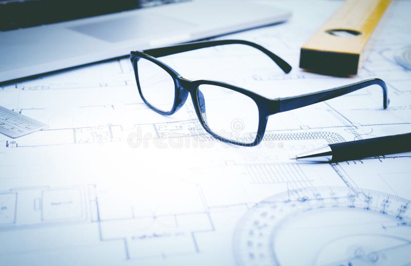 Glasses on plan design.Concepts of architecture,construction,engineering. Glasses on plan design.Concepts of architecture,construction,engineering