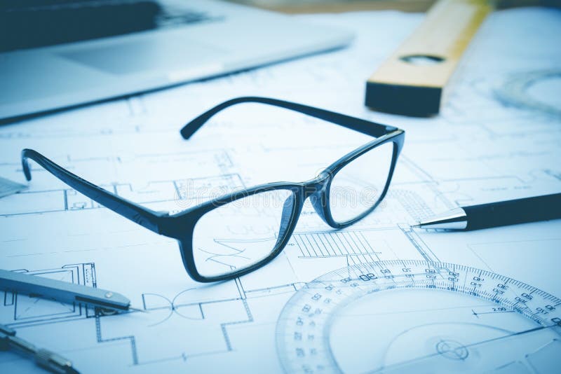 Glasses on plan design.Concepts of architecture,construction,engineering. Glasses on plan design.Concepts of architecture,construction,engineering