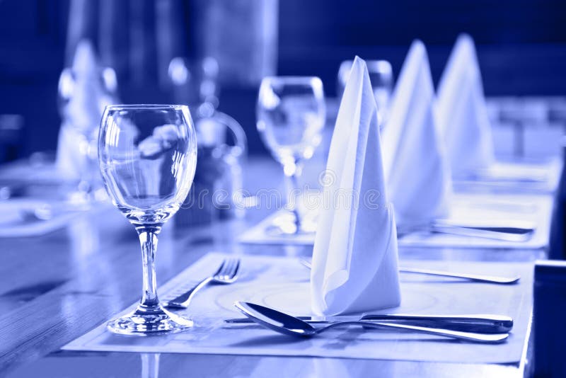 Glasses and plates on table in restaurant