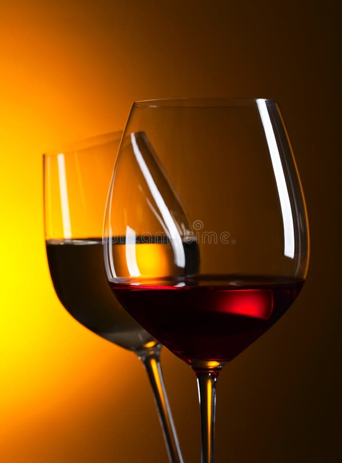 Glasses with red and white wine. Alcohol, cabernet.