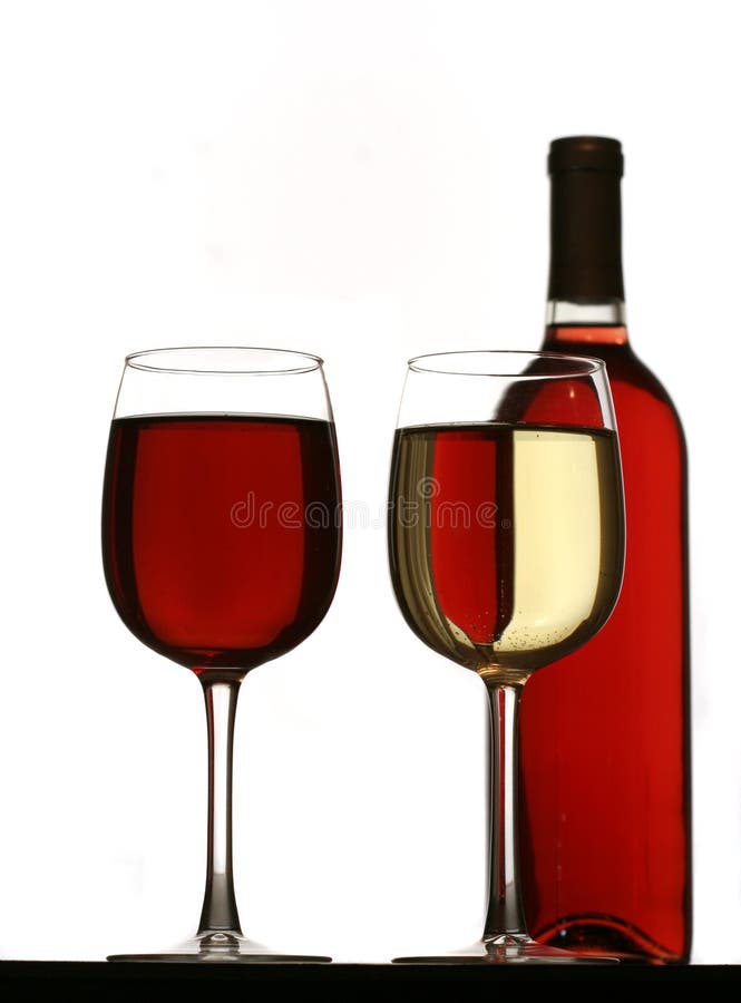 Glasses of Red and White Wine, with Red and White Wine Bottles Behind