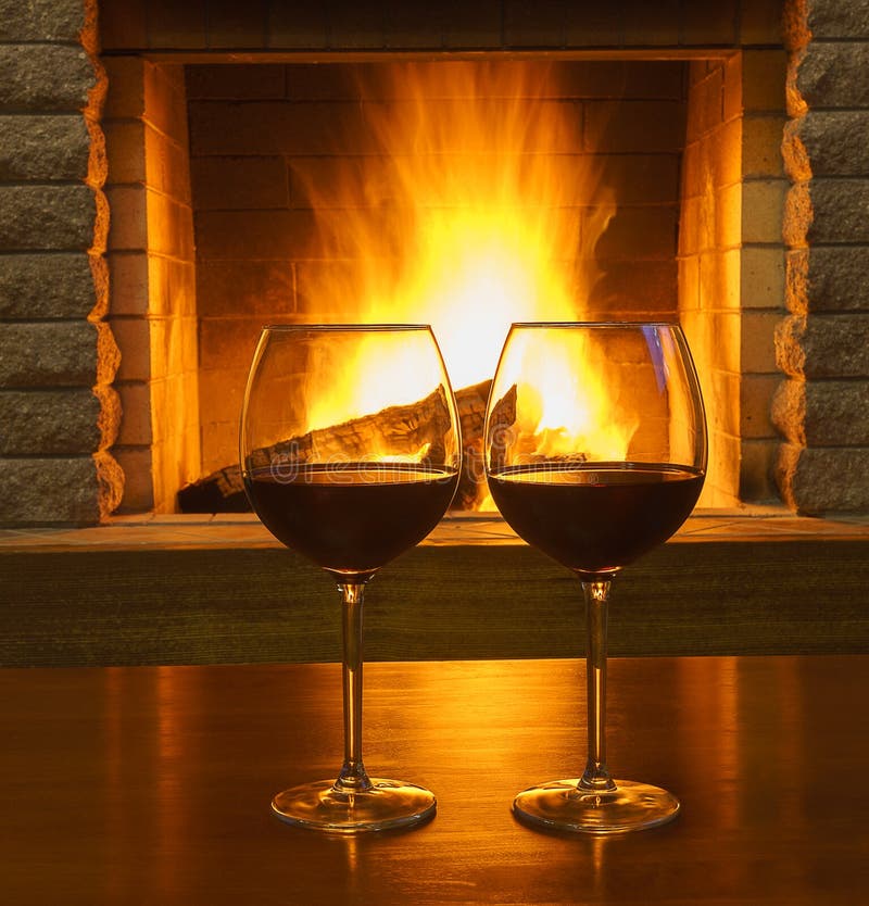 Glasses with Red Wine before Cozy Fireplace. Stock Photo - Image of ...
