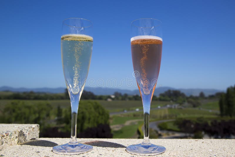 Glasses with sparkling wine in sunny day