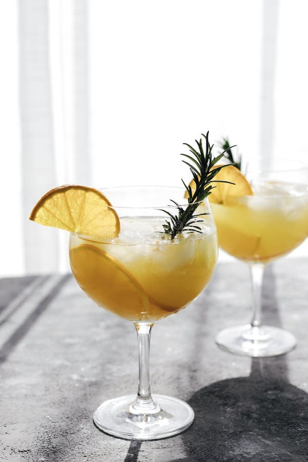 https://thumbs.dreamstime.com/b/glasses-summer-refreshing-cool-drinks-cocktails-orange-rosemary-branch-table-against-background-window-218491832.jpg