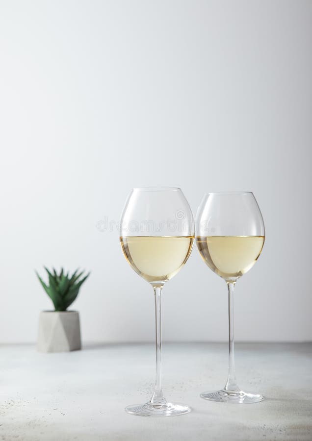 Glasses of White Wine and Small Green Flower on Light Background Stock Photo Image of