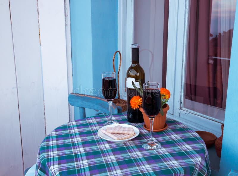 Glasses of wine on balcony stock photo. Image of relax 145129406