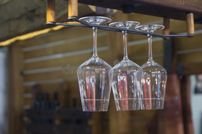 Glasses of Wine. Glasses Hanging Above the Bar in the Restaurant Stock