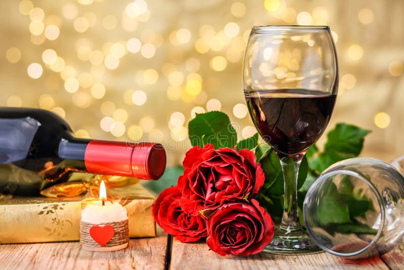 https://thumbs.dreamstime.com/b/glasses-wine-roses-gift-burning-candle-valentine-s-day-concept-two-glasses-wine-red-roses-gift-box-wine-bottle-138405025.jpg