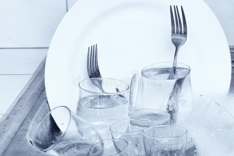 Glassware,cutlery and Dishes in the Kitchen Sink Stock Image Image of