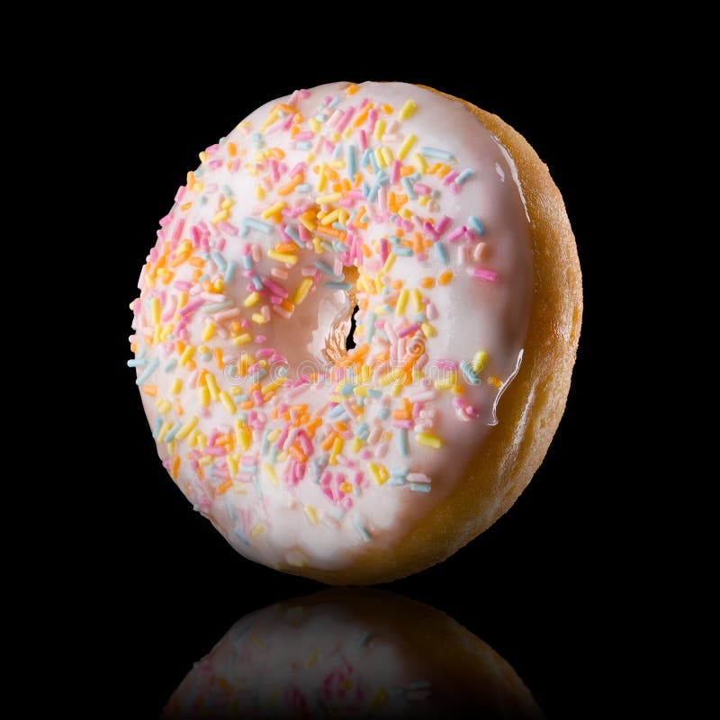 Set Of Glazed Donut With Sprinkles On A Black Background Stock Photo