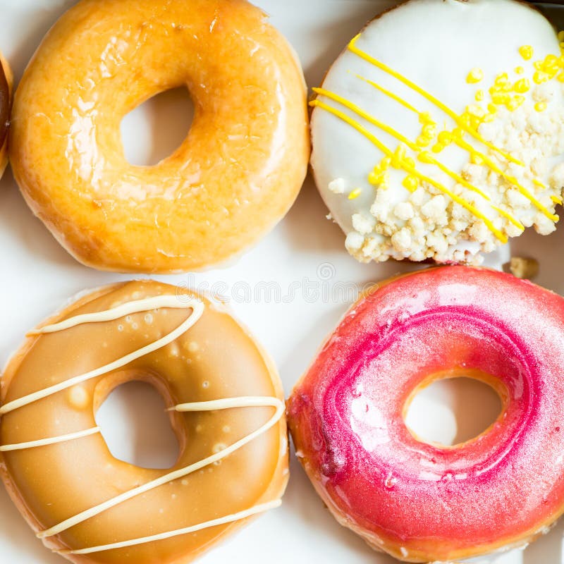 Glazed Doughnuts with Colourful Sprinkles and Icing Stock Image Image