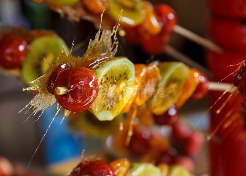 Glazed fruit on a stick