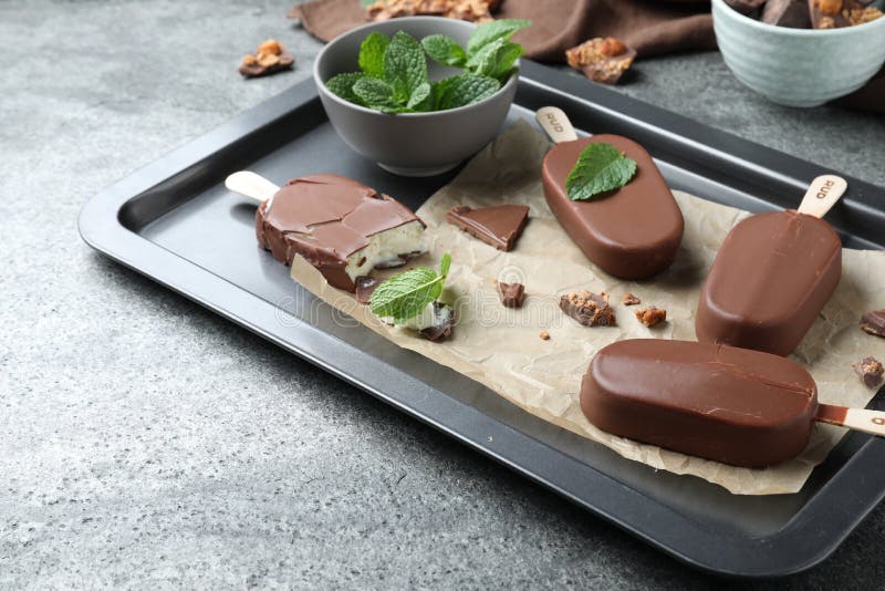 Glazed Ice Cream Bars, Fresh Mint and Chocolate on Baking Tray Stock