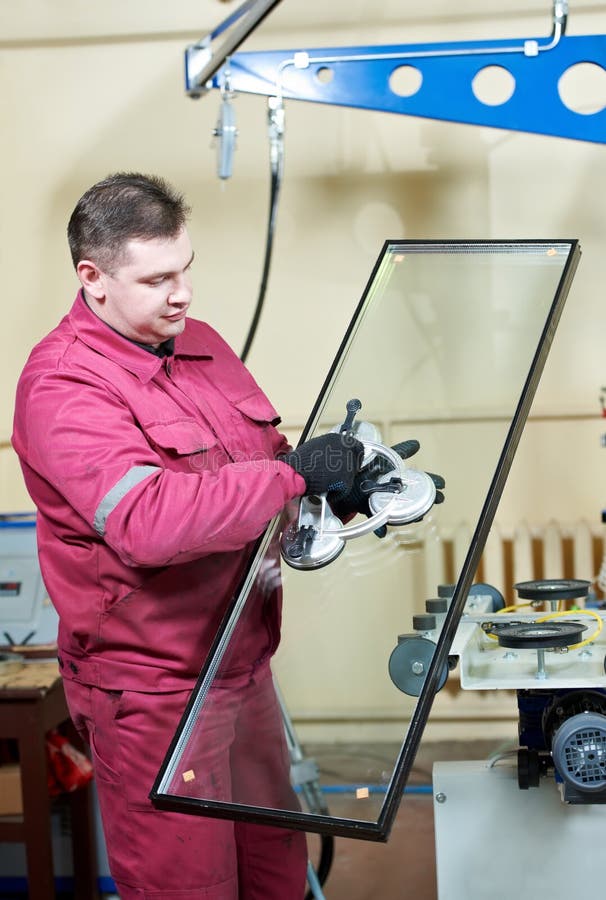 Glazier worker with glass stock image. Image of instrument 25266369