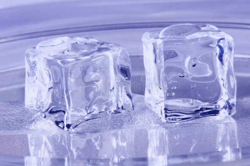 Blue Ice Cubes melting on a tray. Blue Ice Cubes melting on a tray