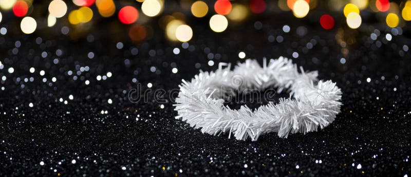 A gleaming white tinsel border on a colorful bokeh background, leaving enough space for festive text or annotations. Annotations ai stock images, royalty-free photos and pictures