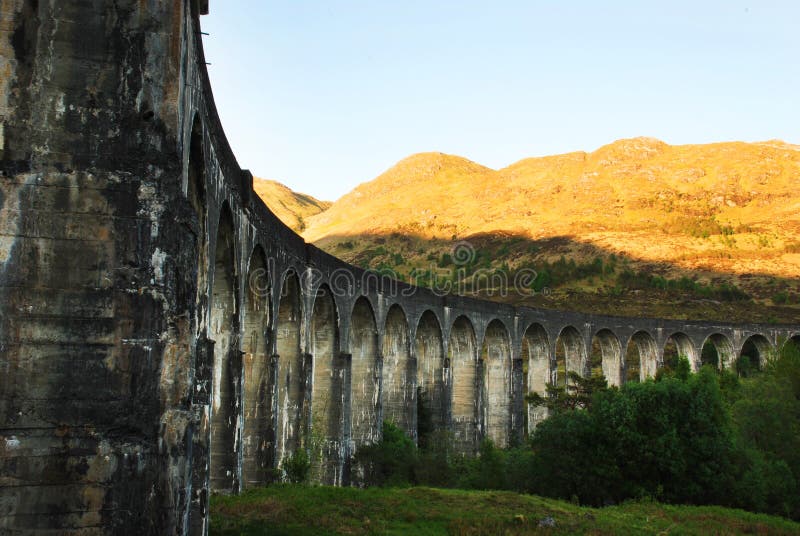 A View of the Famous Glenfinnan Viaduct in Scotland. The Glenfinnan Viaduct railway in Scotland, United Kingdom stock photo A View of the Famous Glenfinnan Viaduct in Scotland. The Glenfinnan Viaduct railway in Scotland, United Kingdom stock photo