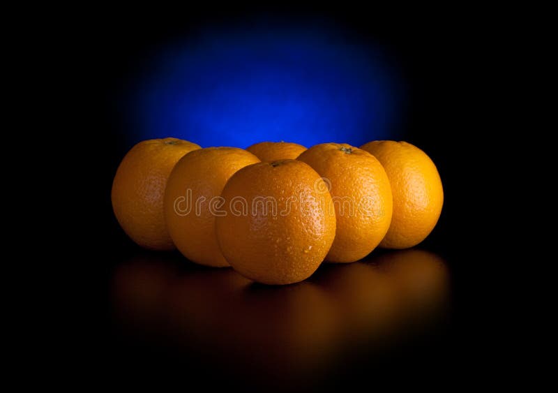 Oranges like billiard balls isolated on black. Oranges like billiard balls isolated on black