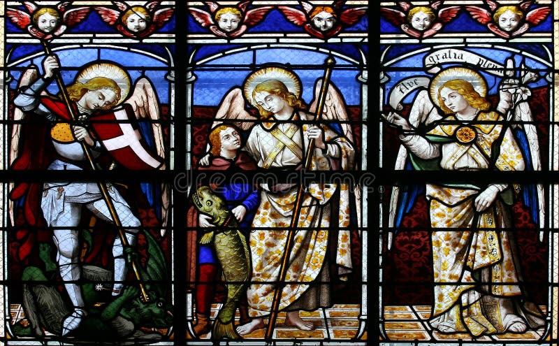 Stained glass window in St.Sulpice church (Fougeres, France), depicting (from left to right) The Archangels: Michael, Raphael and Gabriel. Stained glass window in St.Sulpice church (Fougeres, France), depicting (from left to right) The Archangels: Michael, Raphael and Gabriel.