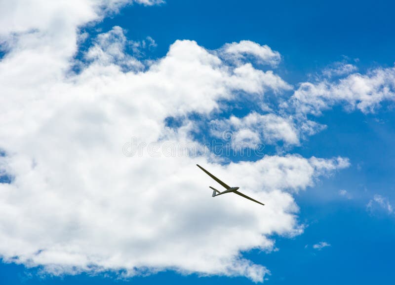 A Glider Flying in Bleu Sky with Big White Clouds. Stock Photo Image of extreme, speed 107548824