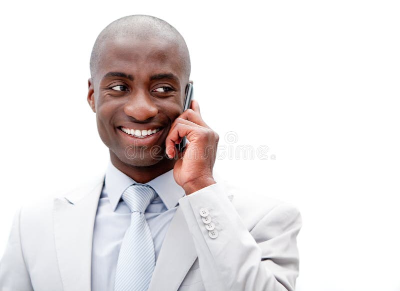 Smiling african businessman on the phone against a white background. Smiling african businessman on the phone against a white background