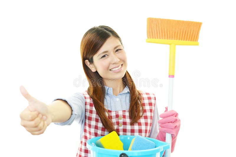Glimlachende Aziatische huisvrouw stock afbeelding Glimlachende Aziatische huisvrouw stock afbeelding
