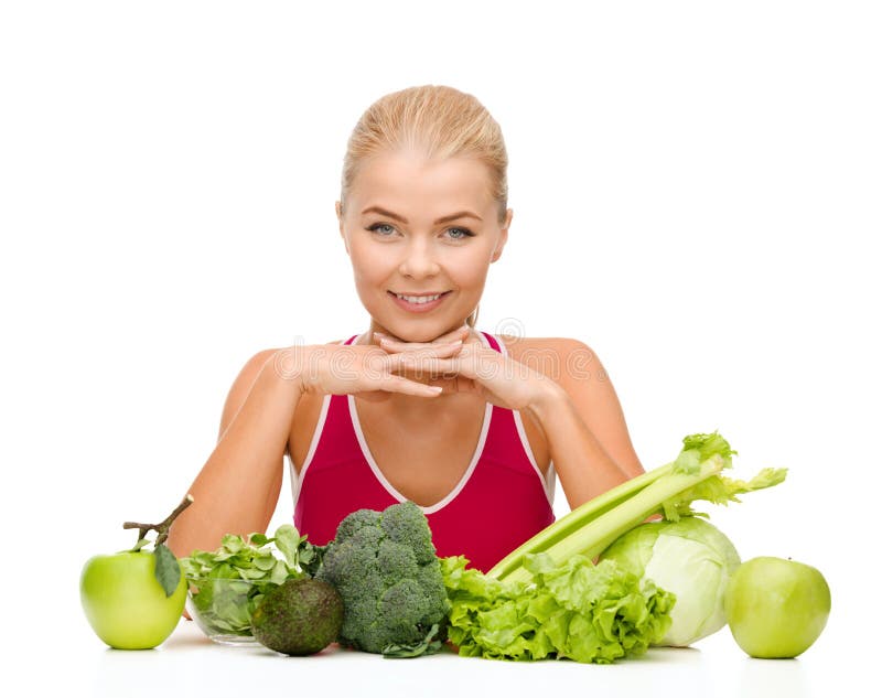Glimlachende sportieve vrouw met natuurvoeding royalty-vrije stock foto's Glimlachende sportieve vrouw met natuurvoeding royalty-vrije stock foto's
