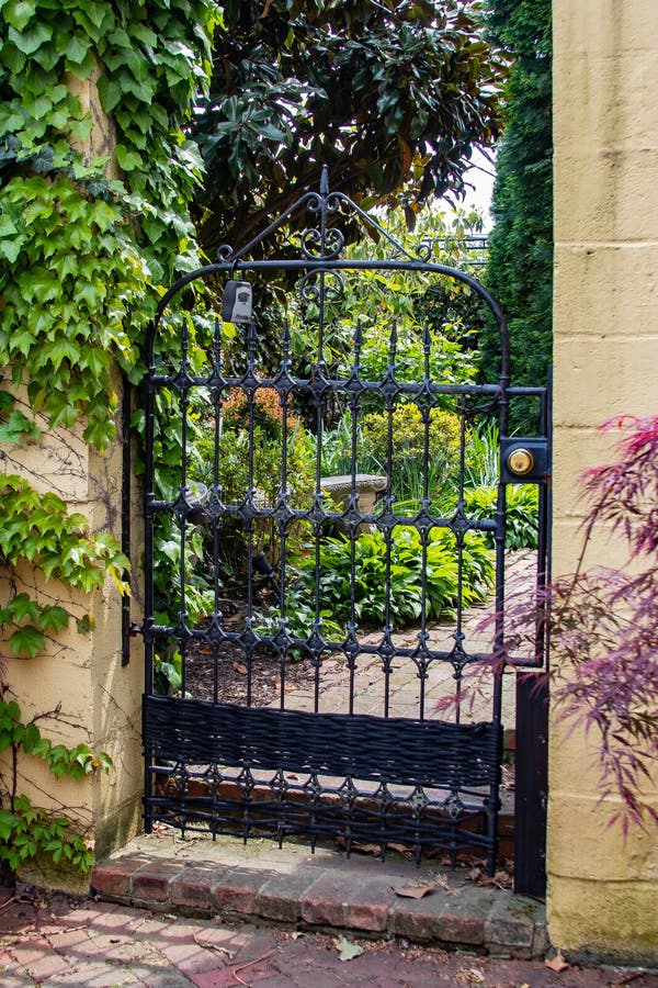 A Glimpse through the Gate of a Spring Time Garden. Stock Photo Image