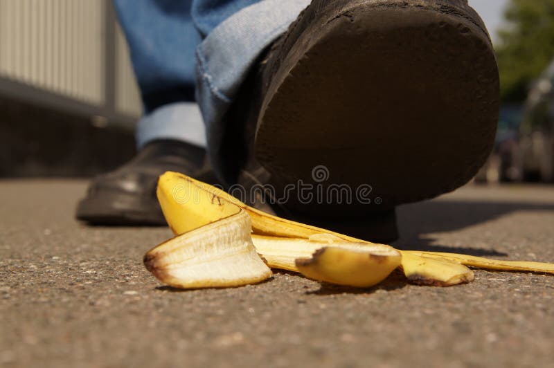 Person about to slip on a banana peel or banana skin . Person about to slip on a banana peel or banana skin .