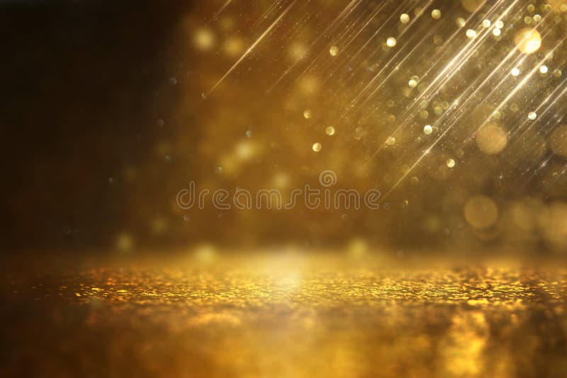 Glitter vintage lights background. black and gold. de-focused