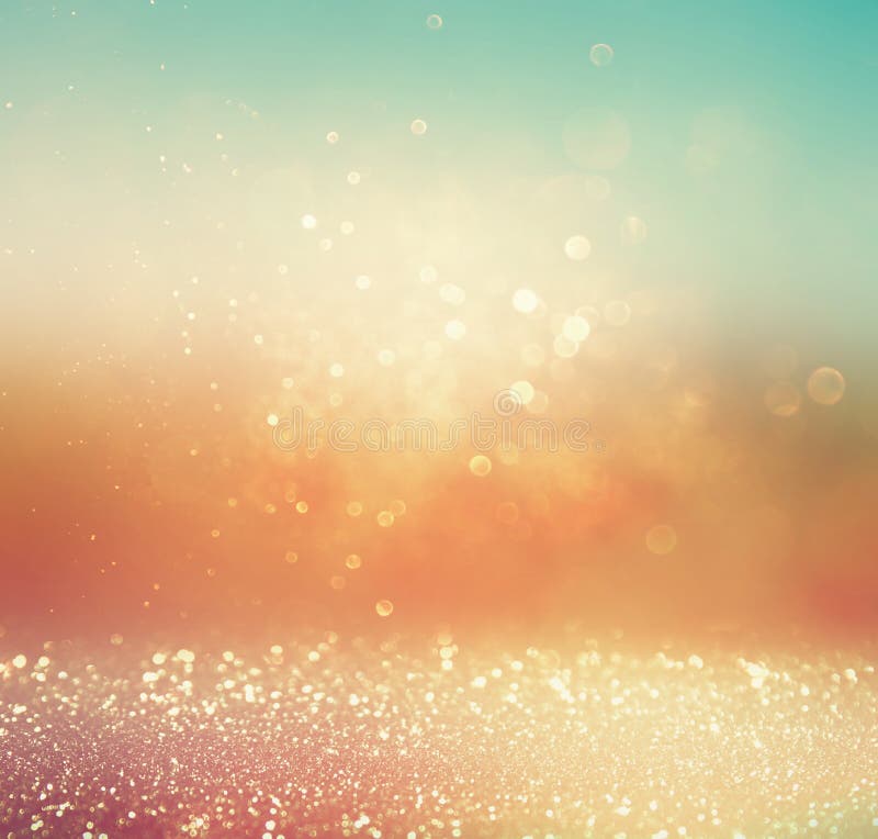 Glitter vintage lights background. gold, silver, blue and white. abstract blurred image. royalty free stock photography