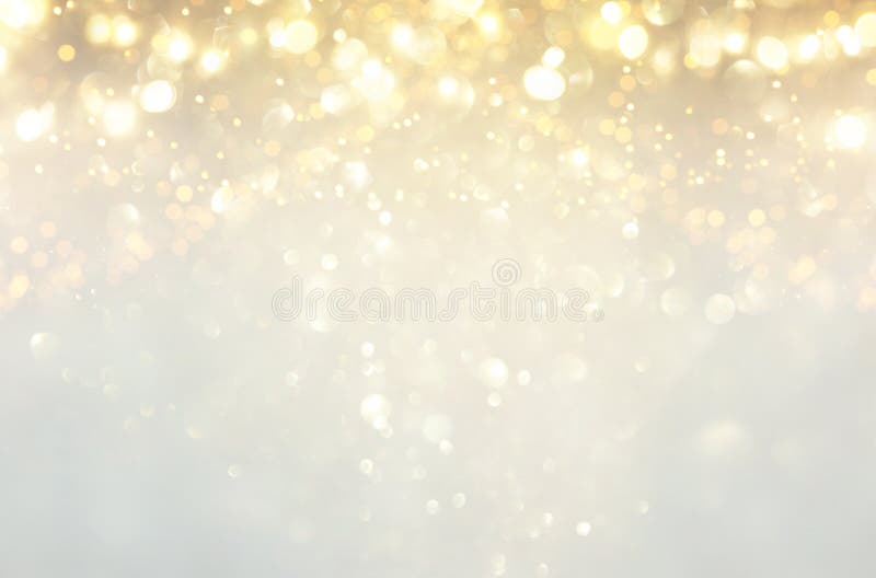 glitter vintage lights background. silver, gold and white. de-focused. royalty free stock photography