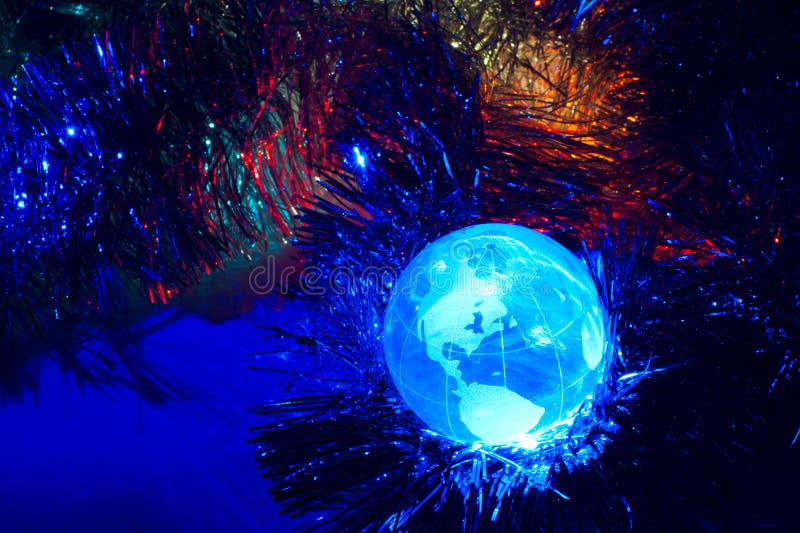 Globe Amérique de la terre avec le bleu de fond de Noël image stock Globe Amérique de la terre avec le bleu de fond de Noël image stock