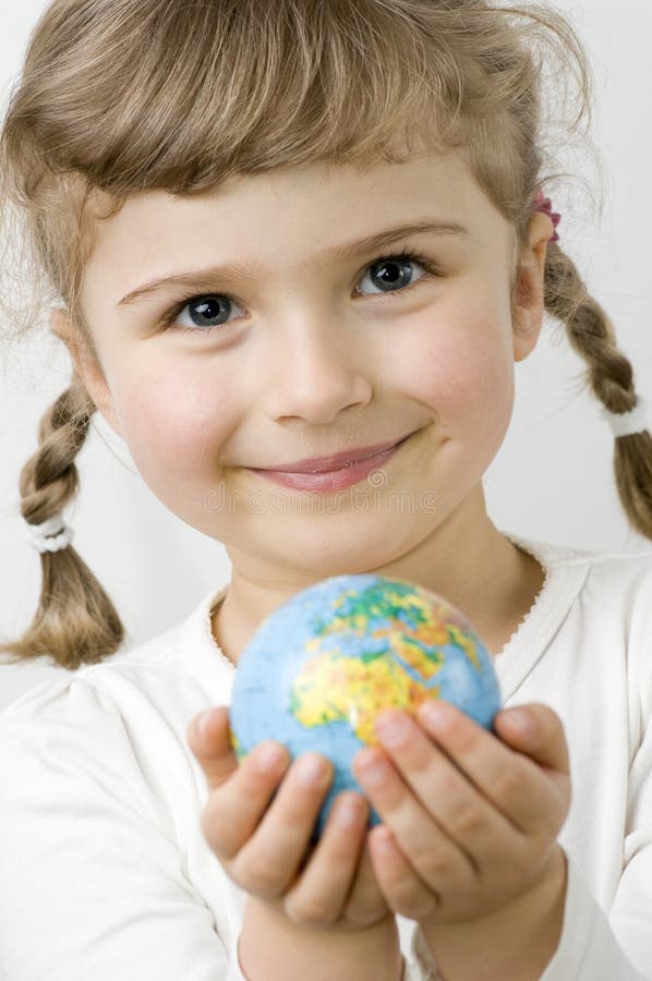 Globe on little girl hands. Globe on little girl hands