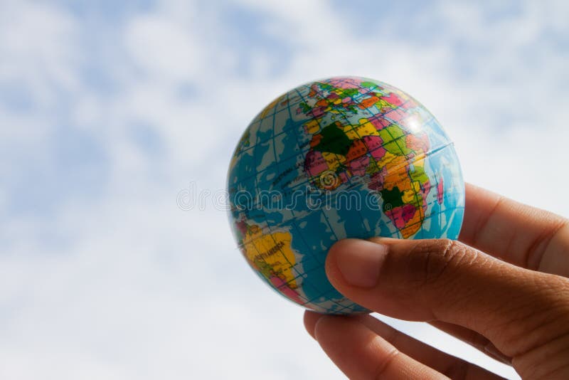 Globe in hand stock image