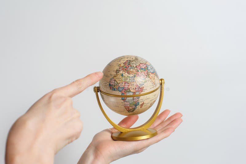 Globe of planet earth in female hand stock photos Globe of planet earth in female hand stock photos