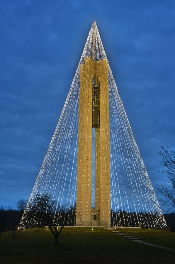 Tree of Light - The Deeds Carillon Bell Tower, decorated with 20,000 white Christmas lights, was built in 1942 in Art modern-style to commemorate the Deeds family in Dayton, Ohio. The 151-foot tall bell tower houses 57 bells which toll every half hour. A carillonneur performs regular live concerts. It is situated on a 65 acre historical park that exhibits two centuries of inventions. Tree of Light - The Deeds Carillon Bell Tower, decorated with 20,000 white Christmas lights, was built in 1942 in Art modern-style to commemorate the Deeds family in Dayton, Ohio. The 151-foot tall bell tower houses 57 bells which toll every half hour. A carillonneur performs regular live concerts. It is situated on a 65 acre historical park that exhibits two centuries of inventions.