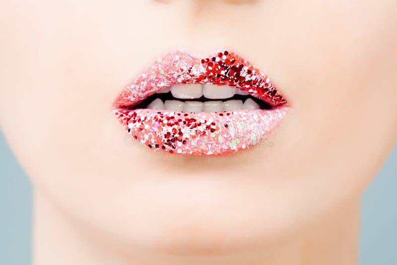 Glossy lips, beautiful makeup with red and pink lipstick. Close up macro beautiful mouth.