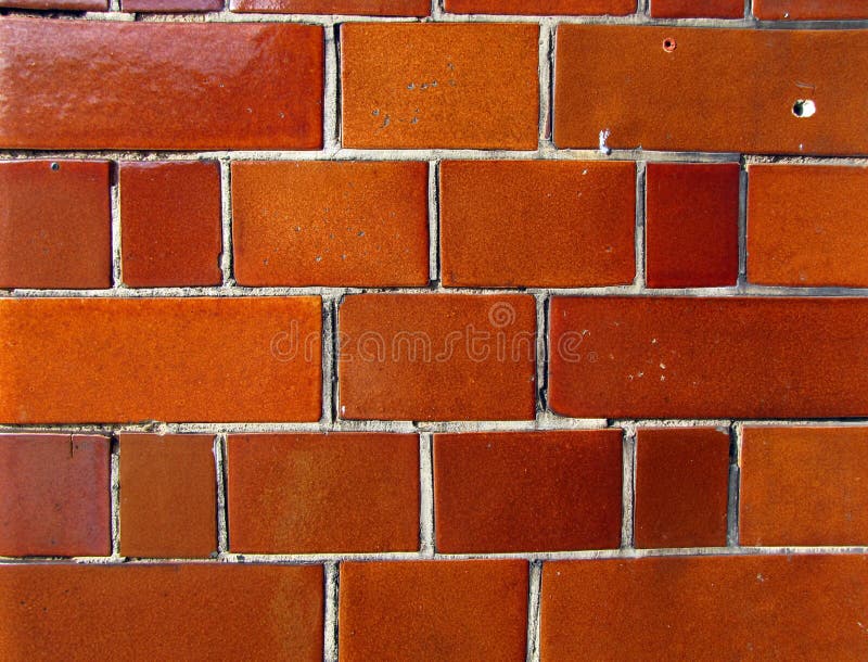 Glossy orange brick wall stock photo. Image of glossy 10518500
