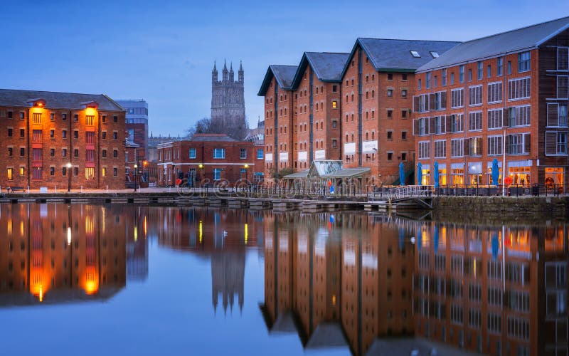 Gloucester docks and Cathedral reflected in the quay on Sharpness at twilight