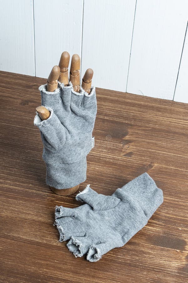 Glove with cut fingers stock image. Image of concept 196996179