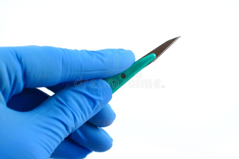 Gloved hand holding scalpel