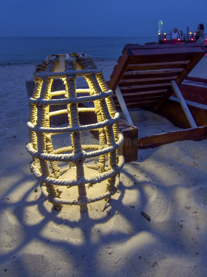 Glowing marine rope lamp, unusual lamp on the beach at night royalty free stock images Glowing marine rope lamp, unusual lamp on the beach at night royalty free stock images
