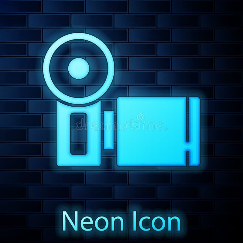 Glowing neon Cinema camera icon isolated on brick wall background. Video camera. Movie sign. Film projector. Vector.