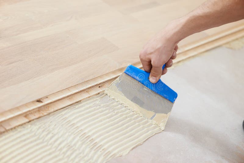 Gluing parquet floor work stock photo. Image of laminate 28537872
