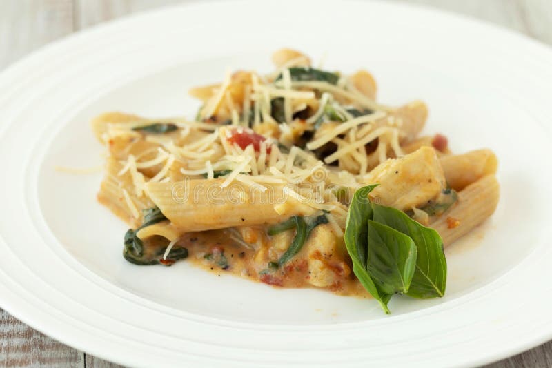 Gluten Free Pasta on Plate with Basil Stock Image - Image of wheat